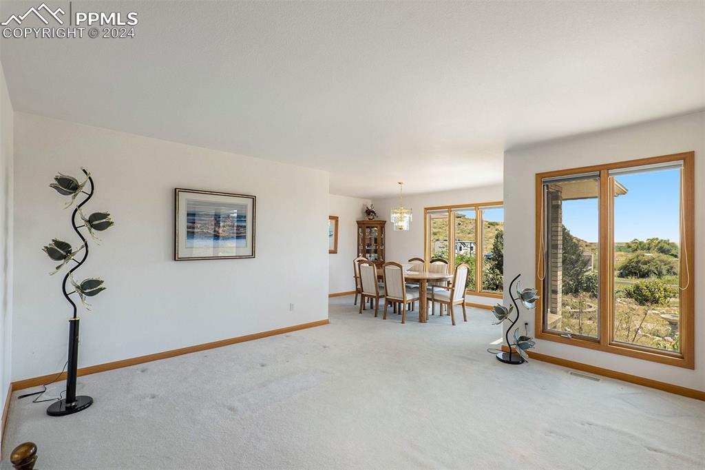 Image 13 of 50: Sitting room with natural light