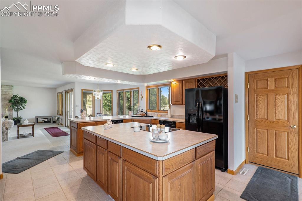Image 14 of 50: Kitchen featuring pendant lighting, sink, fridge with ice dispenser, dishwa