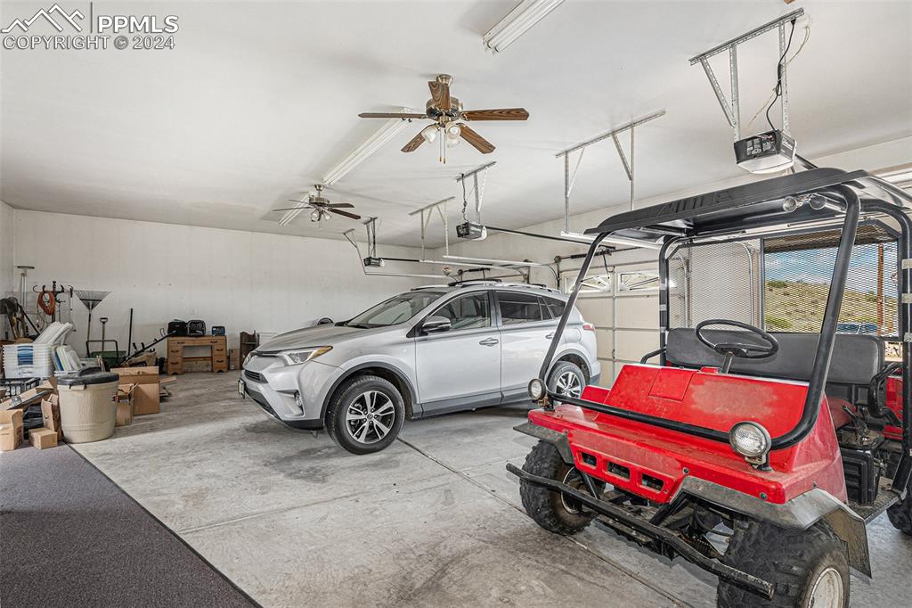Image 43 of 50: Garage with kitchen entrance. Spacious Huge Heated