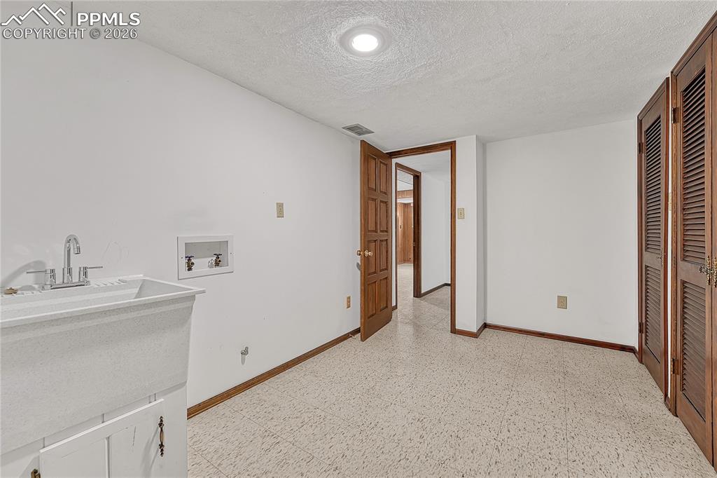 Image 28 of 49: Basement Laundry