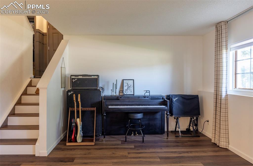 Image 25 of 41: Office area with dark wood-style flooring
