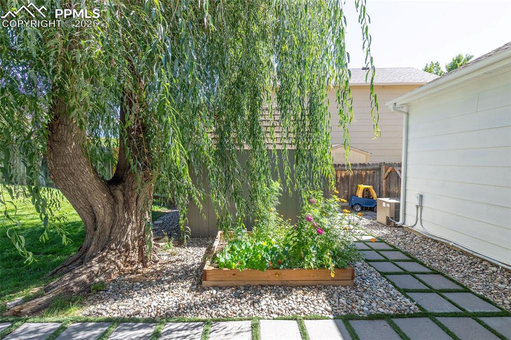 Image 36 of 41: View of yard featuring a garden