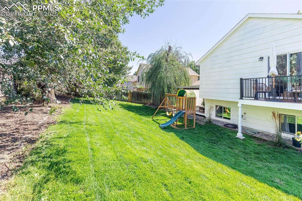 Image 38 of 41: View of yard featuring a playground