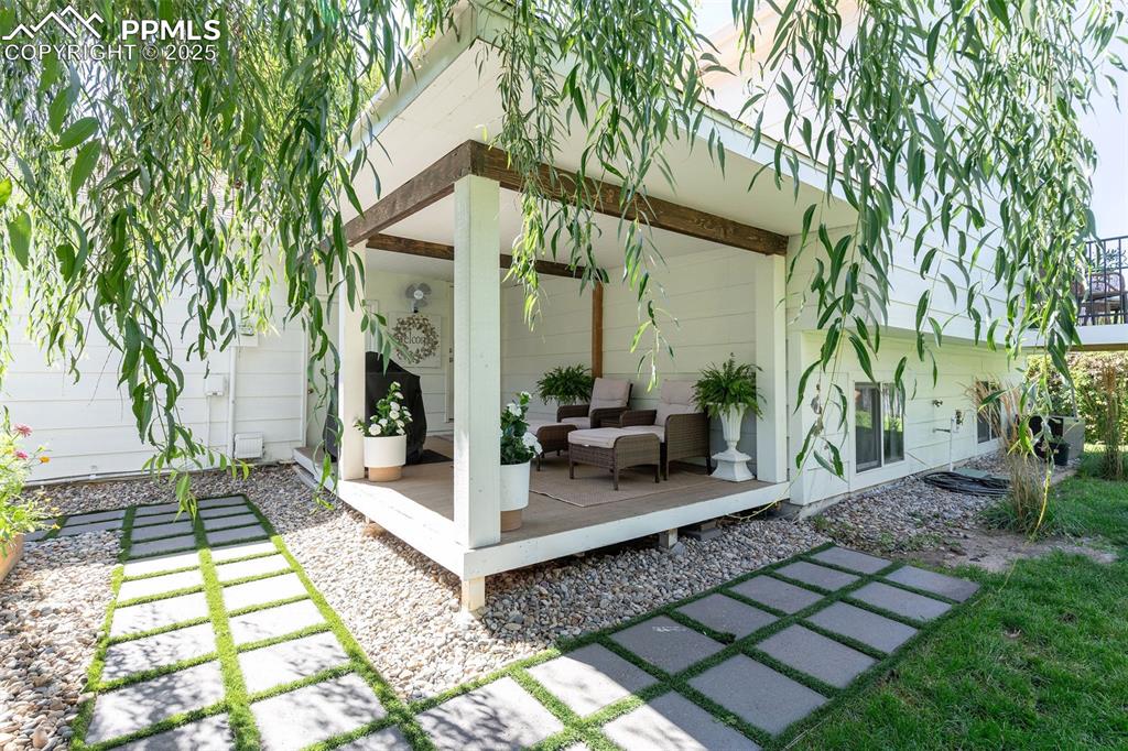 Image 41 of 41: View of patio featuring an outdoor hangout area