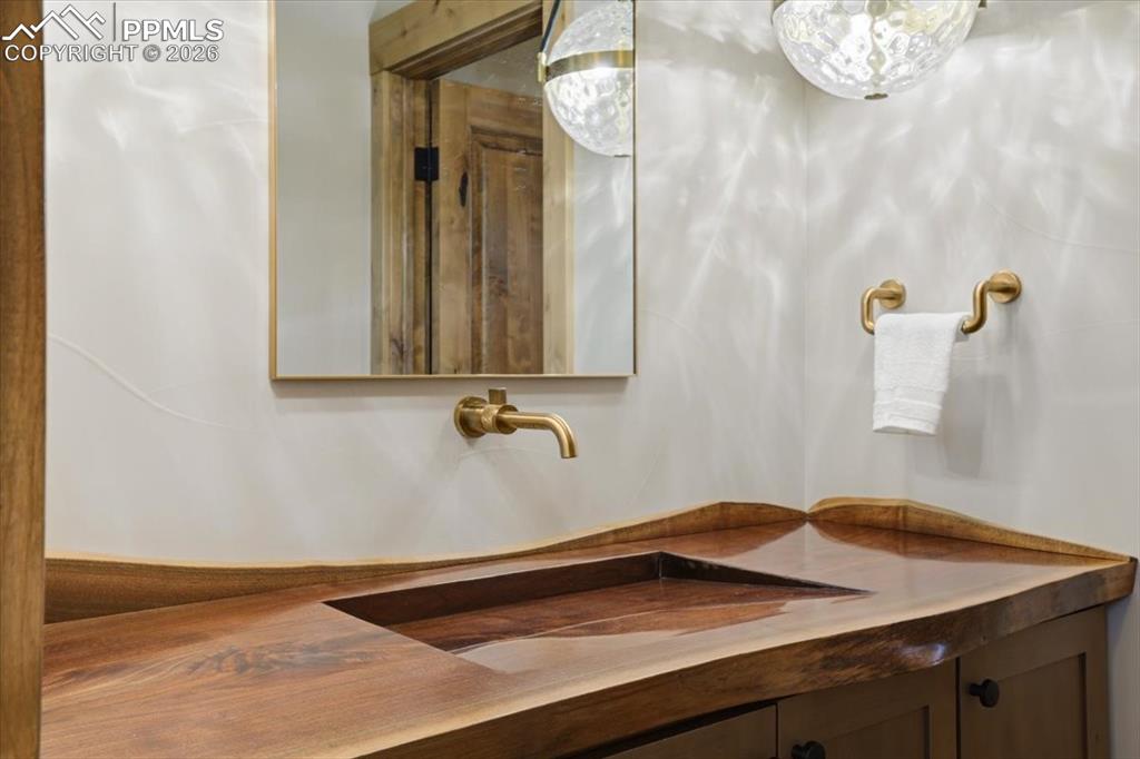 Image 38 of 50: Custom wood carved trough sink