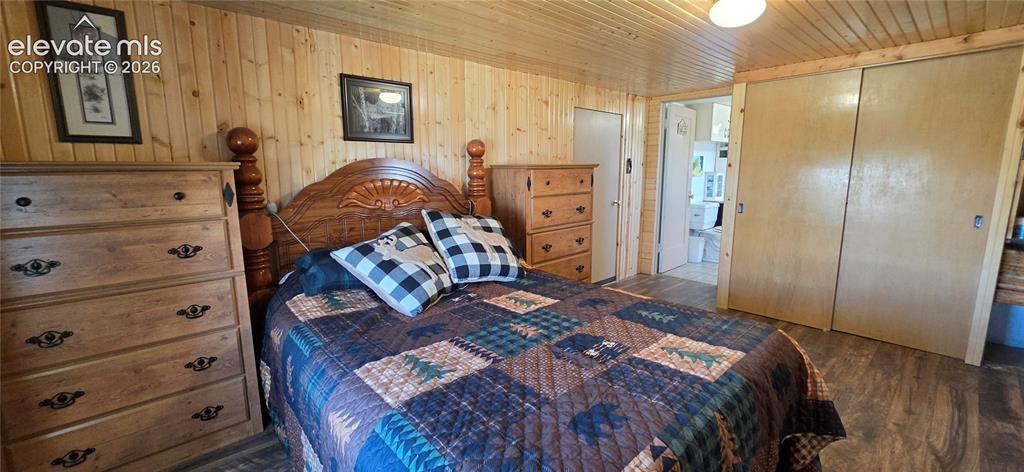 Image 17 of 35: Wood-finish wall paneling, coordinating wood-finish ceiling, wood-finish fl