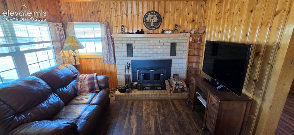 Image 6 of 35: Wood-finish flooring with horizontal wood paneling