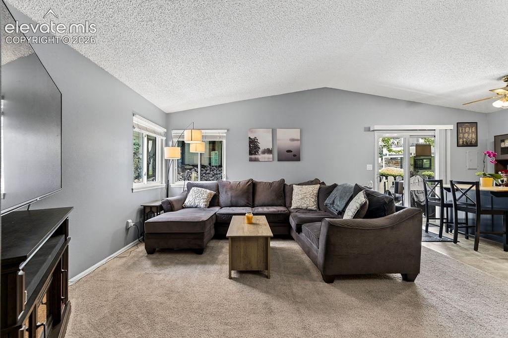 Image 10 of 50: Living room, carpeted