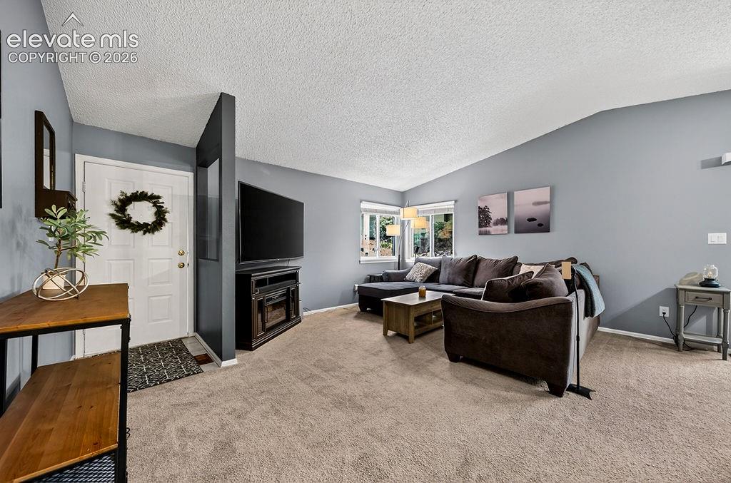 Image 8 of 50: Front door entryway, carpeted