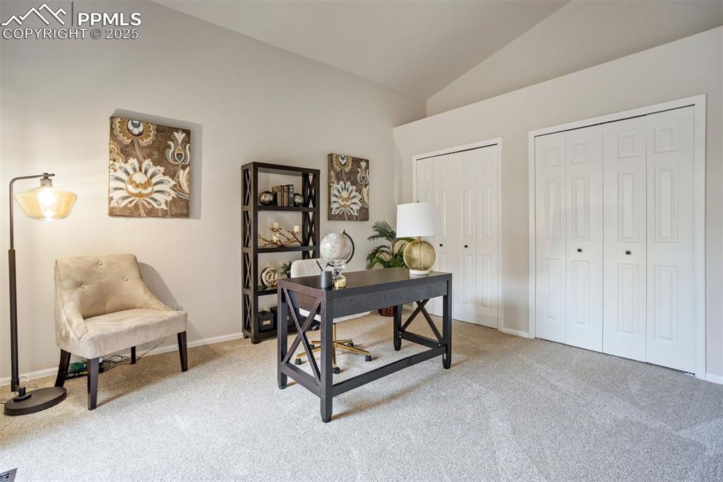 Image 19 of 50: Main level bedroom doubles as an office.