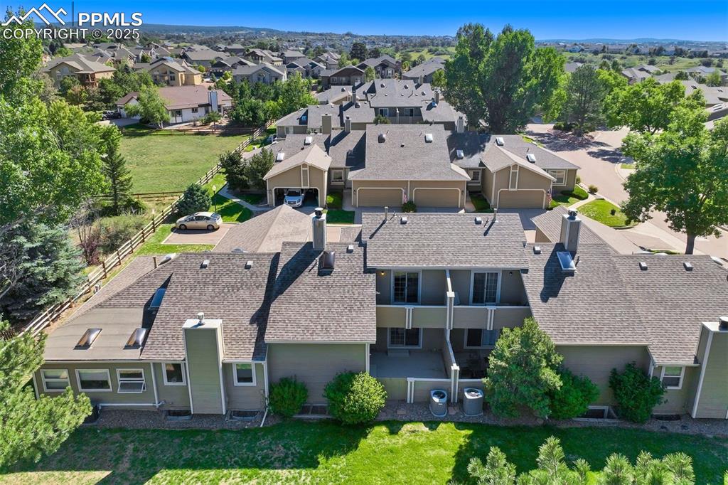 Image 2 of 50: A fenced patio and an upper deck provide great outdoor living experiences i