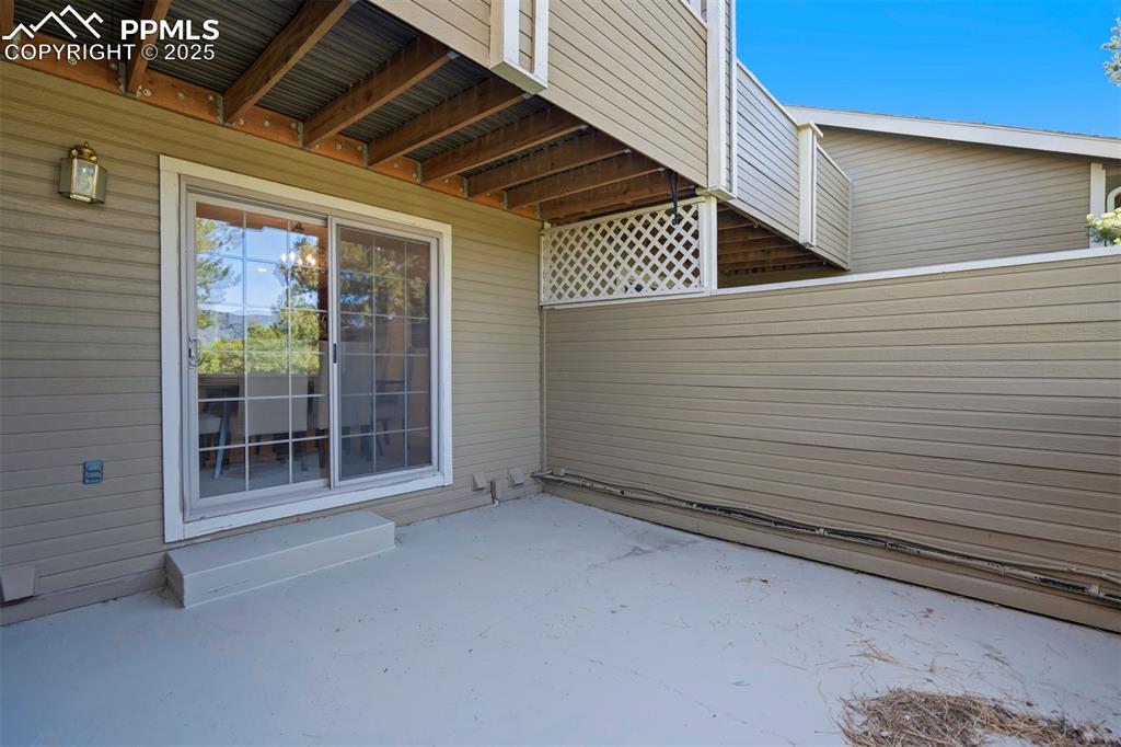 Image 20 of 50: Outdoor main level patio has access from the dining room and the main level