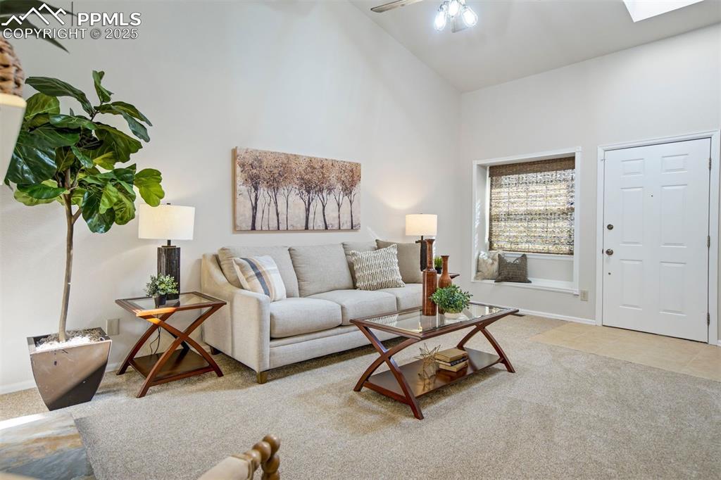 Image 4 of 50: Bright and inviting main living area with abundant light from the window an