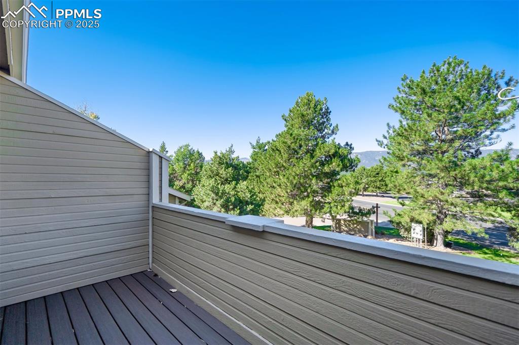 Image 9 of 50: Balcony off of the upper level primary bedroom provides a wonderful perch t