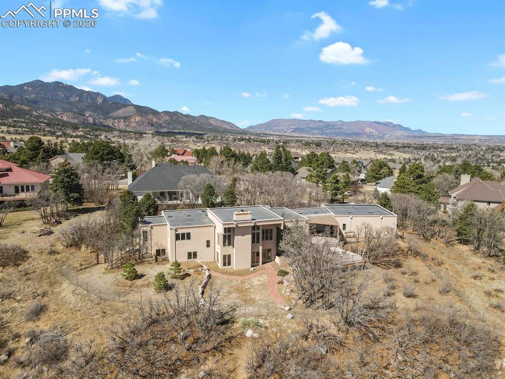 Image 1 of 50: Aerial View of the back of this spacious contemporary ranch home with a ful
