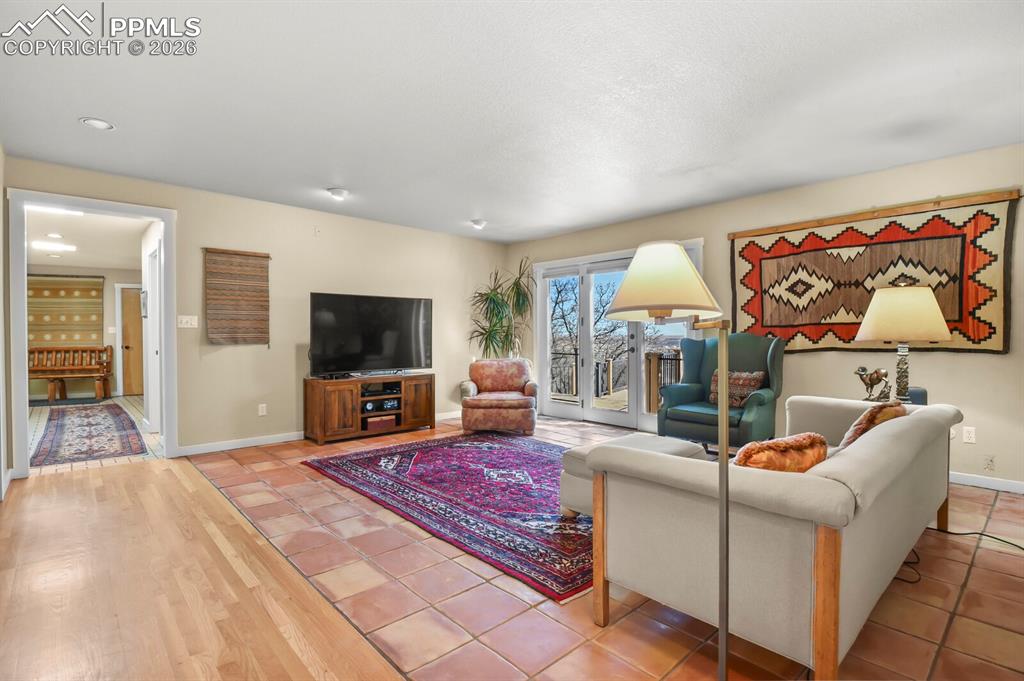 Image 22 of 50: Another view of the family room, showing the french doors to the totally re