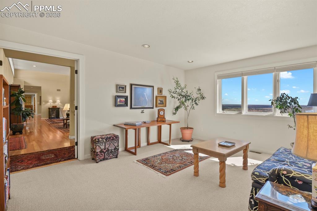 Image 25 of 50: Another view of the sitting room that is part of the Primary Suite.  Double