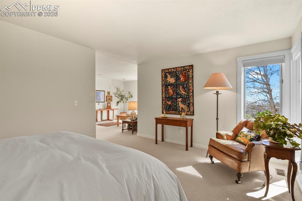 Image 27 of 50: A view from the primary bedroom looking into the sitting room.