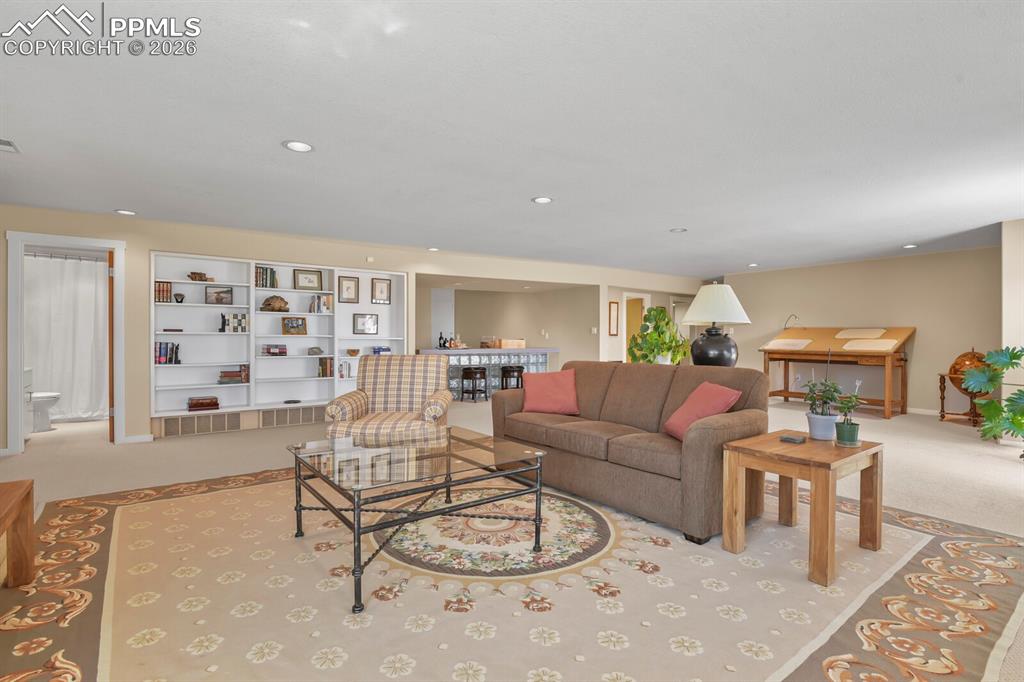 Image 34 of 50: Another view looking at the 2nd Family Room, door into the guest bathroom.