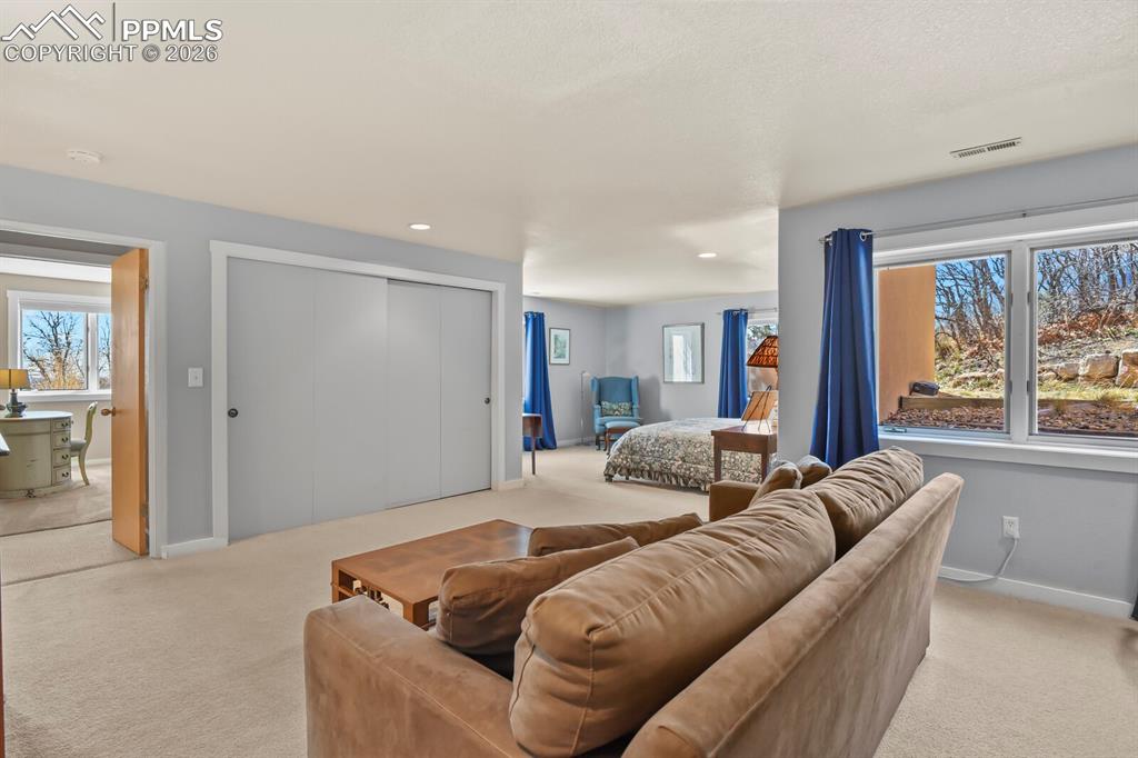 Image 37 of 50: Another view looking from the sitting area in this lower level bedroom suit