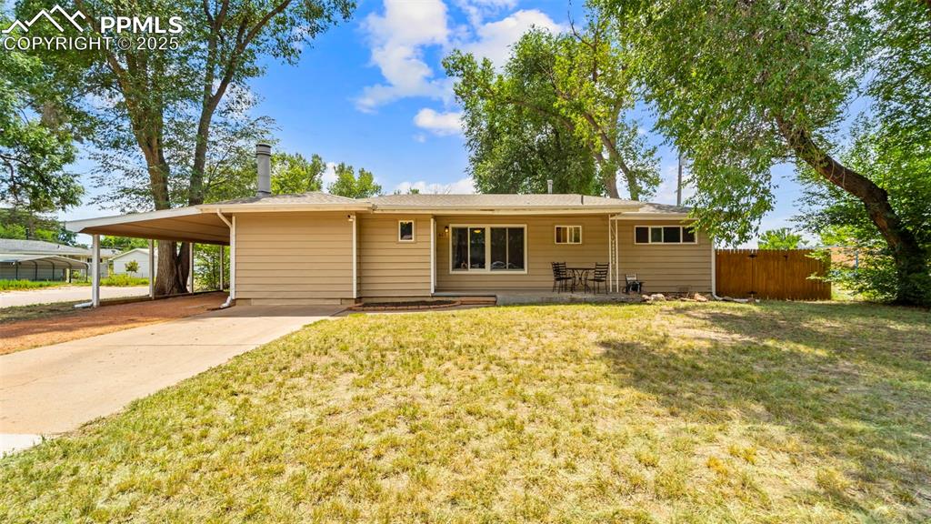 Caption: Ranch style home with carport