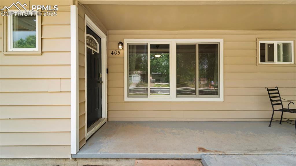 Image 4 of 37: Front entry with concrete porch