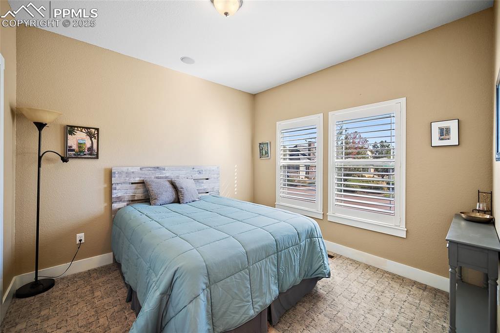Image 22 of 47: Main Level Second Bedroom with Bath