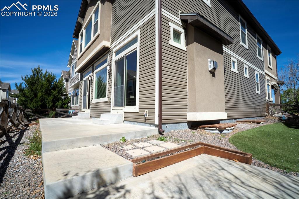 Image 48 of 49: side yard with artificial grass