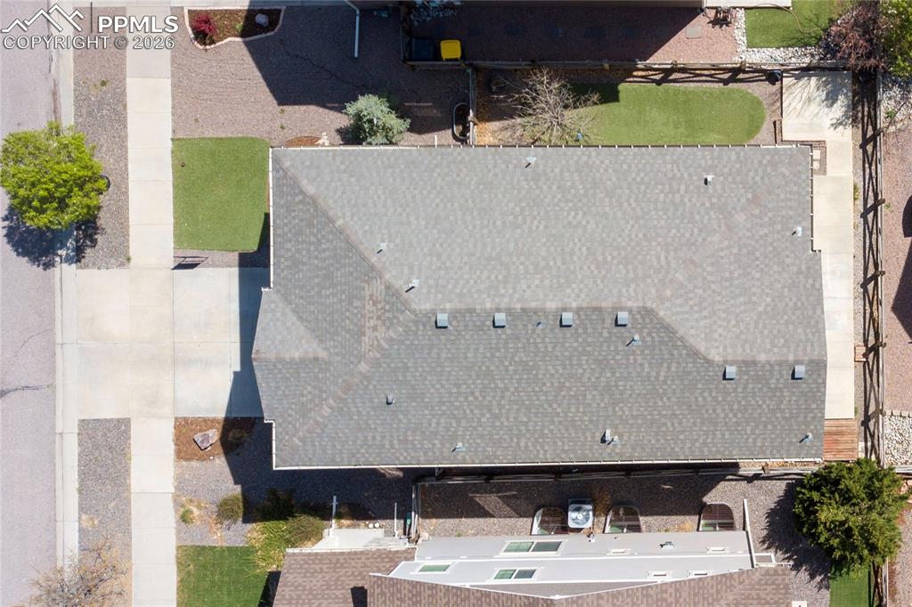 Image 49 of 50: side yard with artificial grass