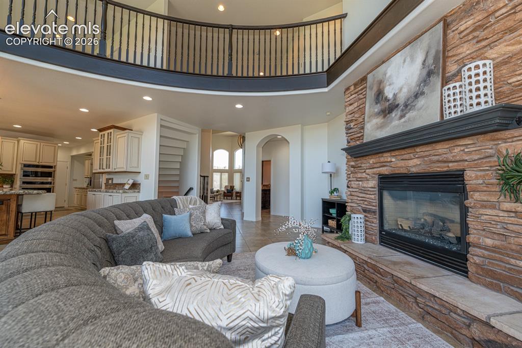 Image 15 of 50: 2 story great room with fireplace