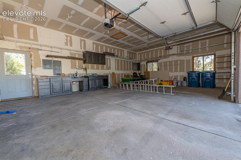 Image 44 of 50: Oversize garage with EV charging