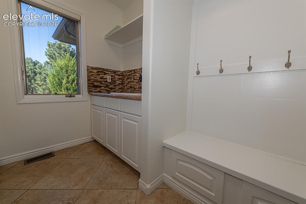 Image 46 of 50: Main level laundry and mud room.