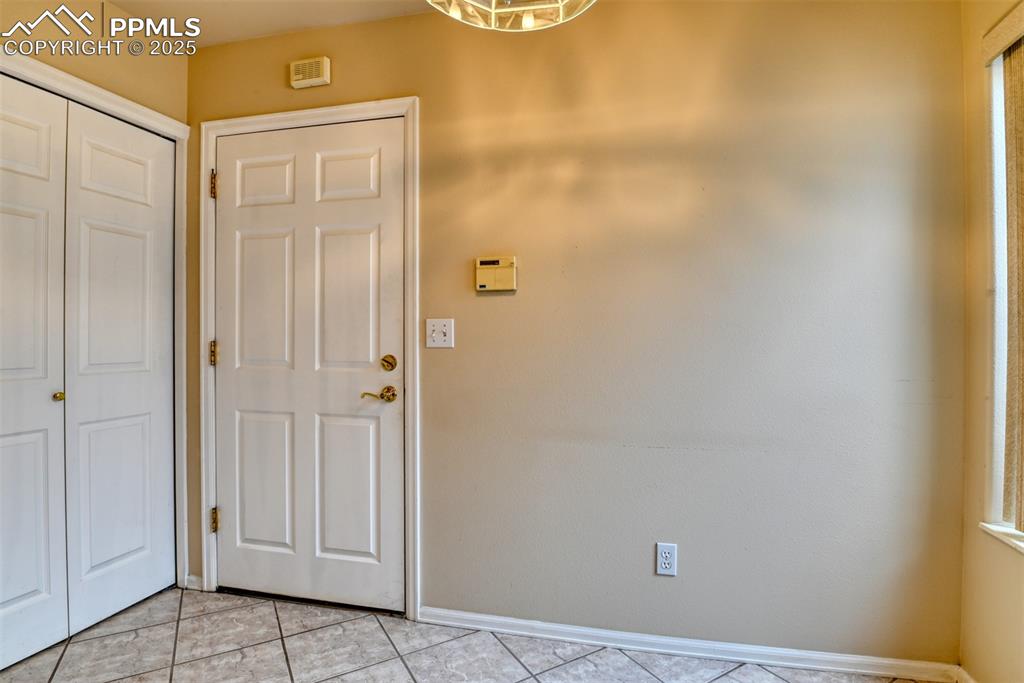 Image 11 of 37: Foyer featuring tile patterned flooring and baseboards