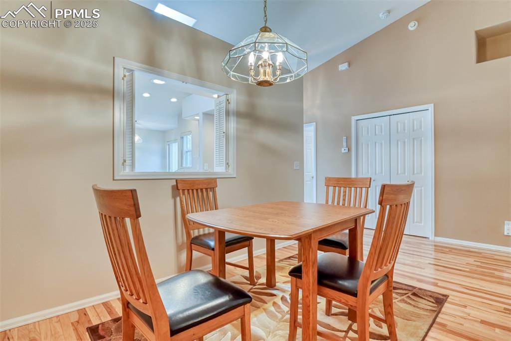 Image 16 of 37: Dining space with light wood-type flooring, a chandelier, and recessed ligh
