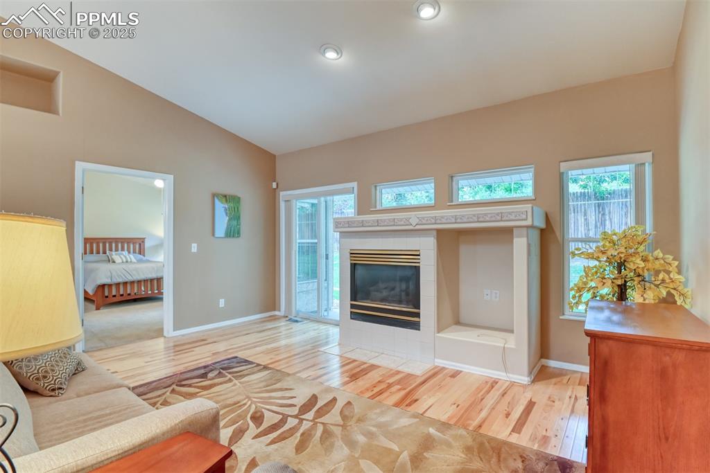 Image 18 of 37: Unfurnished living room featuring light wood finished floors, lofted ceilin