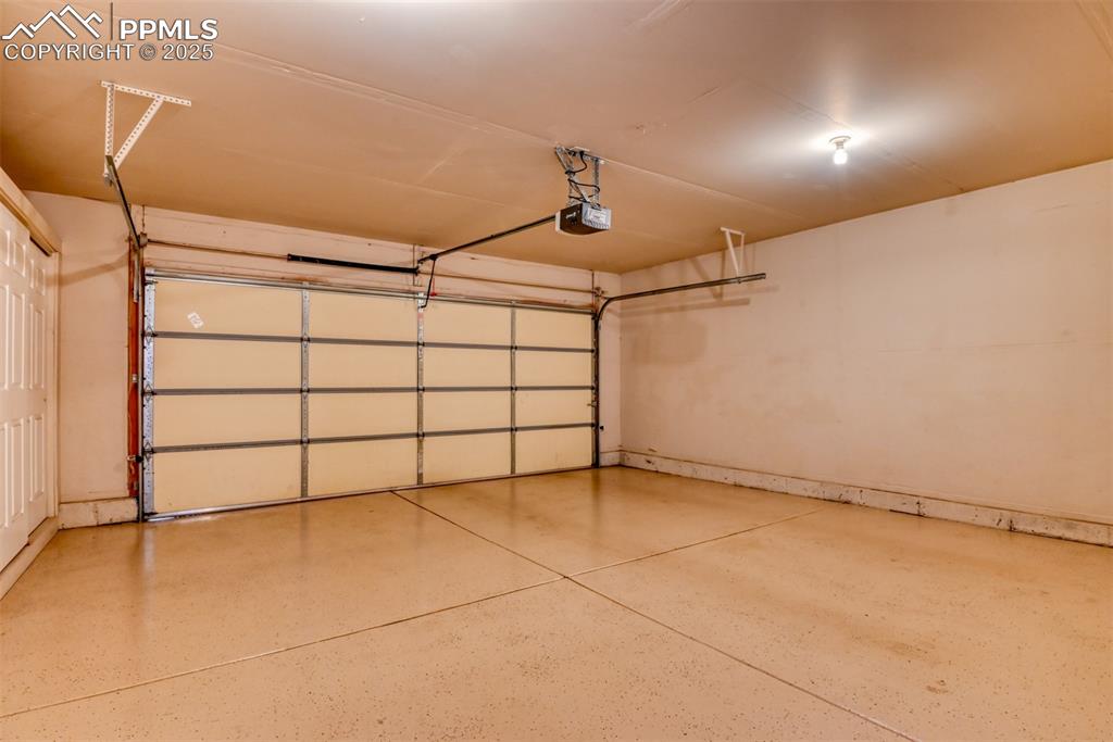 Image 35 of 37: Garage with a garage door opener