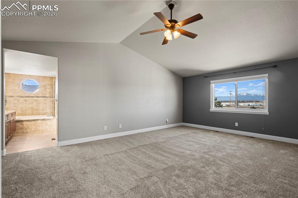 Image 21 of 49: Large Primary with Epic Pikes Peak Views and New Carpet.
