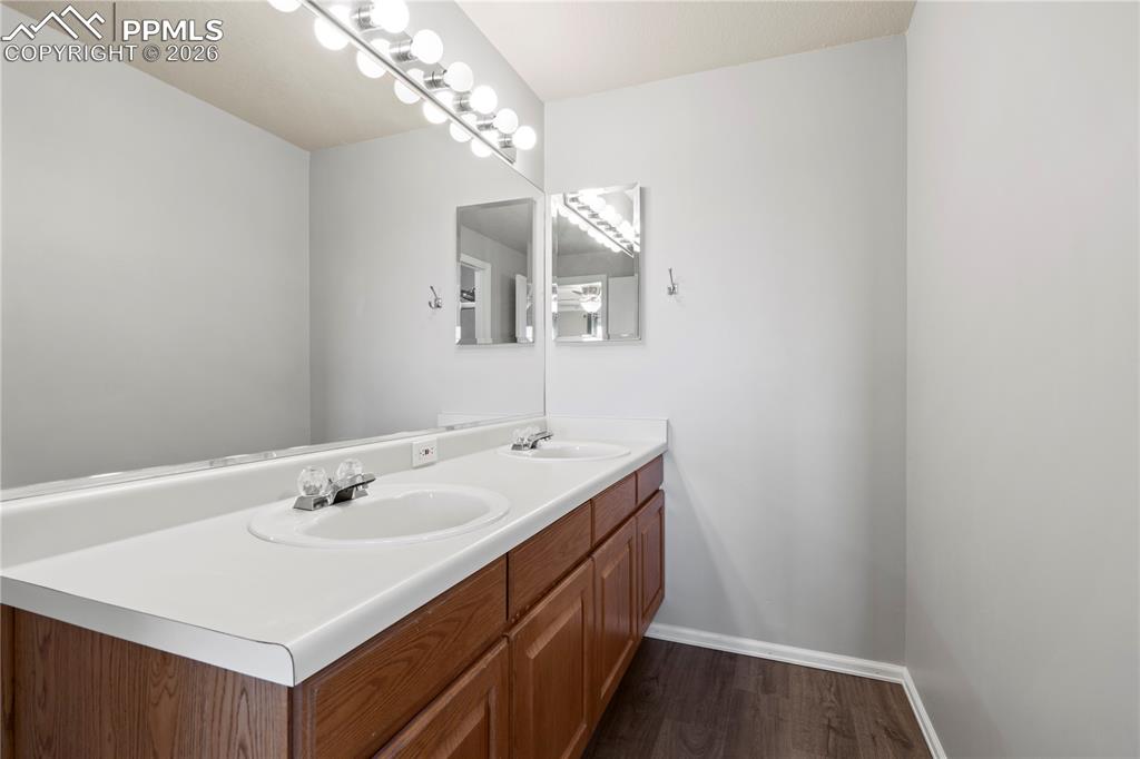 Image 32 of 49: Upstairs Full Bath connects to Bedroom 1