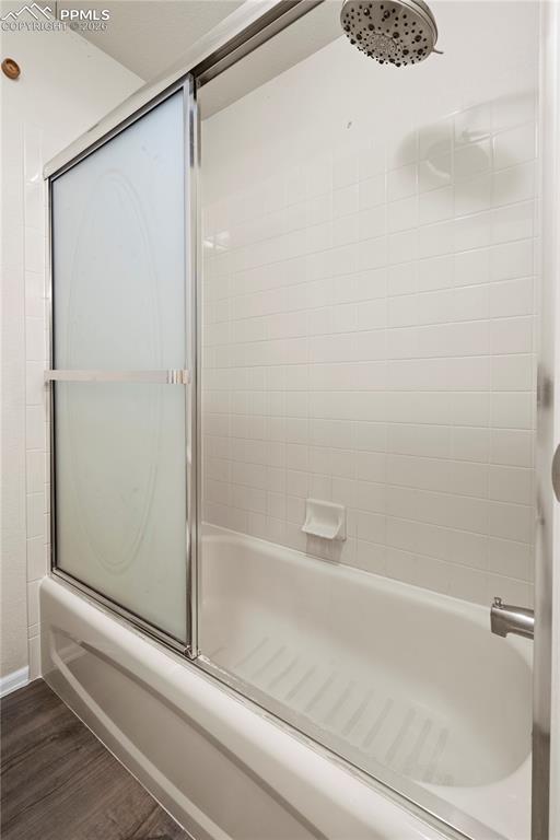 Image 33 of 49: Upstairs Full Bath connects to Bedroom 1