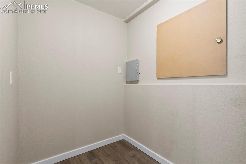 Image 43 of 49: Storage in basement leading to crawlspace storage.