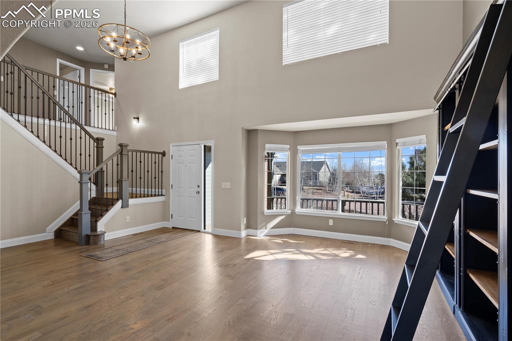 Image 6 of 49: Bright Living room with Vaulted Ceilings