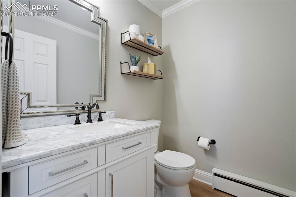 Image 32 of 49: Main level half Bathroom 