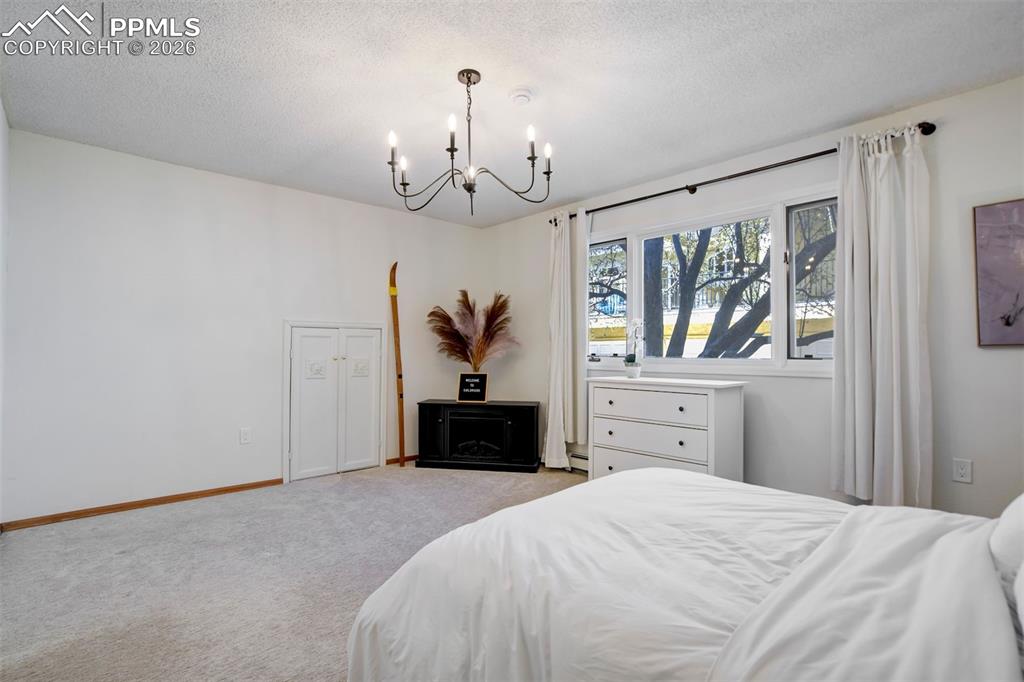 Image 37 of 49: Basement bedroom #5 with adorable HarCarpeted bedroom