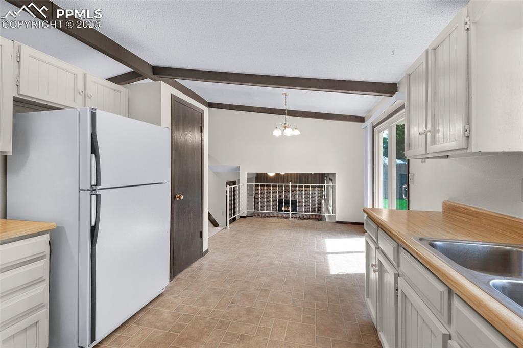 Image 11 of 49: Kitchen with dining area
