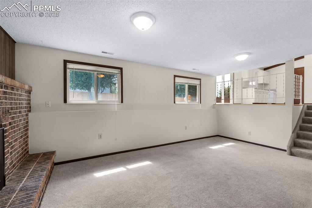 Image 12 of 49: Family room with gas fireplace