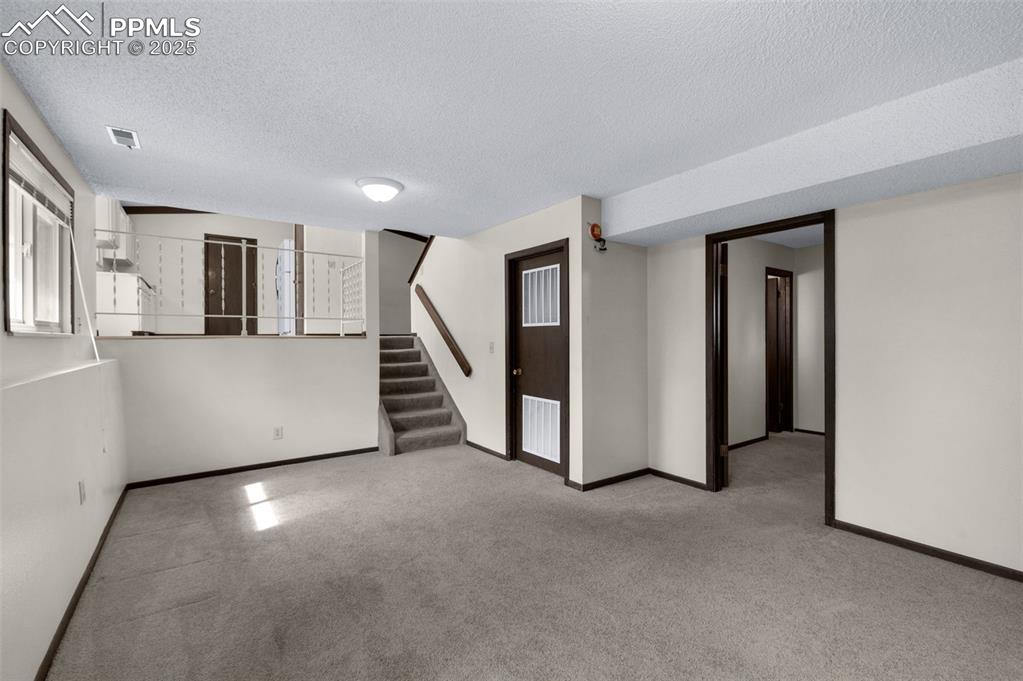 Image 14 of 49: Family room looking towards the kitchen and dining area.