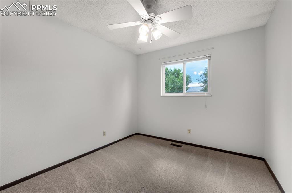 Image 22 of 49: Upstairs bedroom, freshly painted