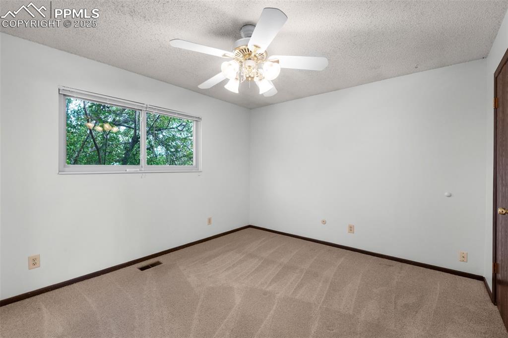 Image 23 of 49: Upper level bedroom