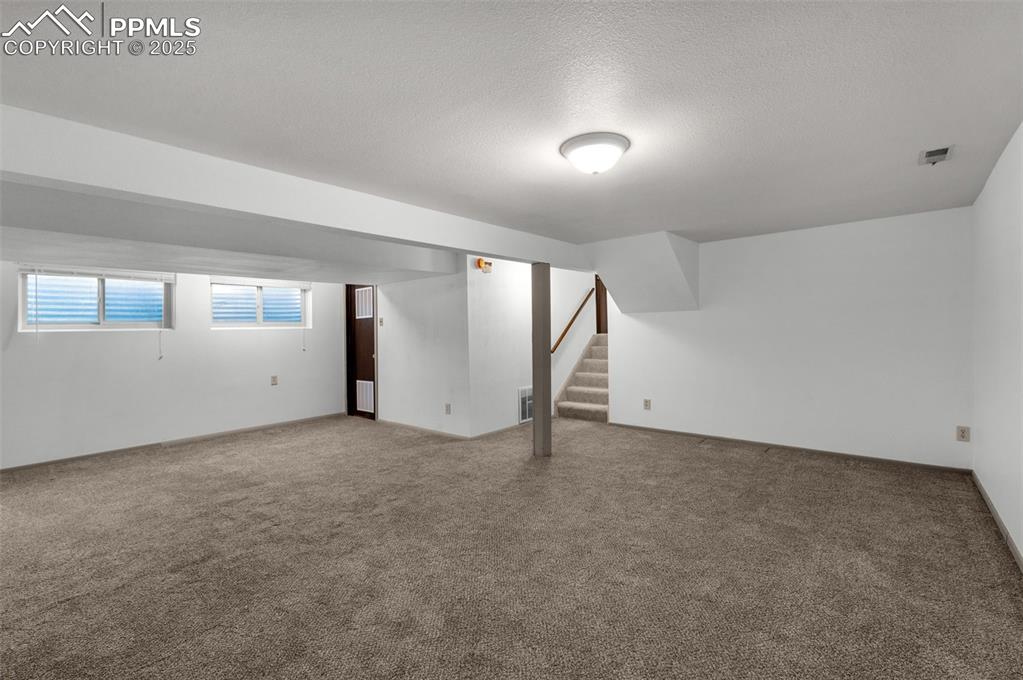 Image 28 of 49: Large finished basement