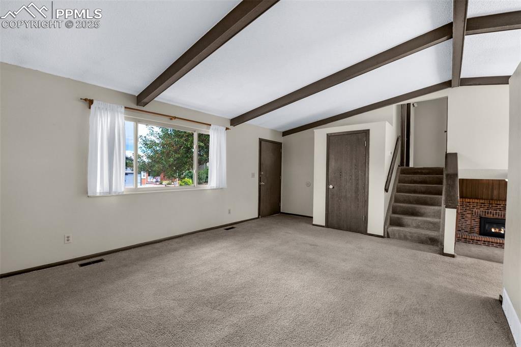Image 3 of 49: Vaulted ceilings in living room